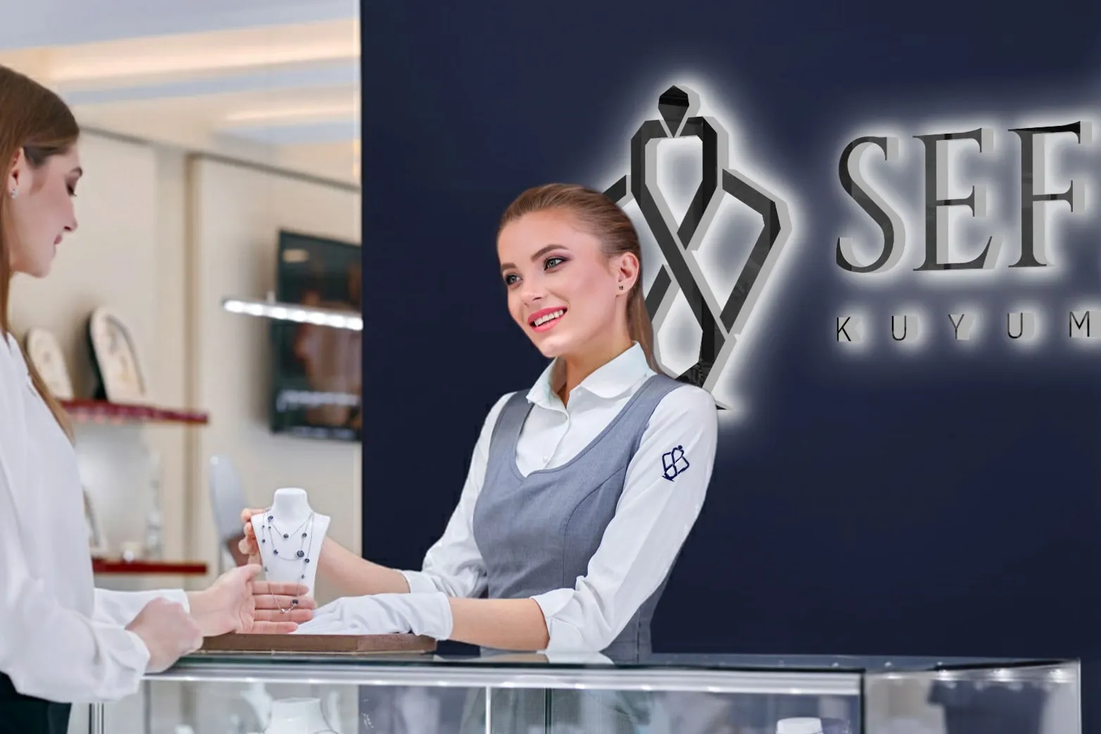 In the Sefine store; illuminated logo signage behind the counter